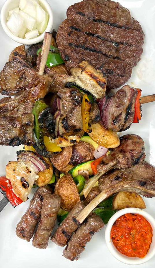 Grilled steak and vegetables on fire at a top bar restaurant in Las Vegas offering authentic Croatian Mediterranean cuisine near the Strip.