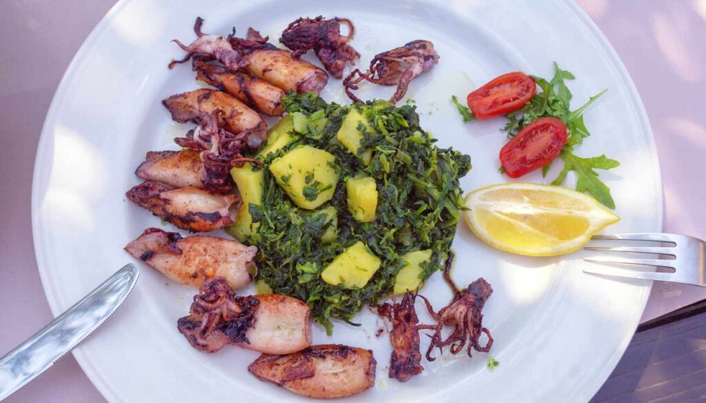 Adriatic Mediterranean  dish with grilled squid with Swiss chard and potatoes